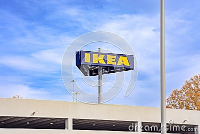 IKEA Sign with blue sky and parking structure in Norfolk, USA Editorial Stock Photo