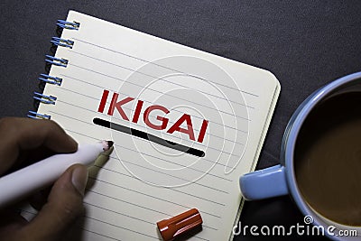 IKIGAI text on the book isolated on office desk background. Japanese concept Stock Photo