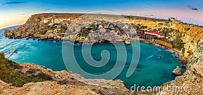 Il-Mellieha, Malta - Panoramic skyline view of the beautiful Popeye Village at Anchor Bay Editorial Stock Photo