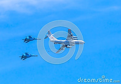 Il-78 (Midas) aerial refueling tanker demonstrates refueling of 2 Su-34 (Fullback) Editorial Stock Photo