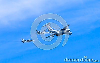 Il-78 (Midas) aerial tanker demonstrates demonstrates refueling of 2 Su-24 (Fencer) Editorial Stock Photo