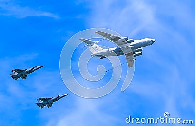 Il-78 (Midas) aerial tanker demonstrates refueling of 2 MiG-31 (Foxhound) Editorial Stock Photo