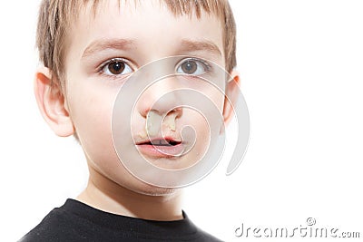 Ill boy with flu and green rhinitis Stock Photo