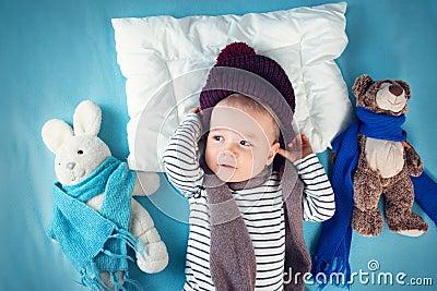 Ill boy lying in bed Stock Photo