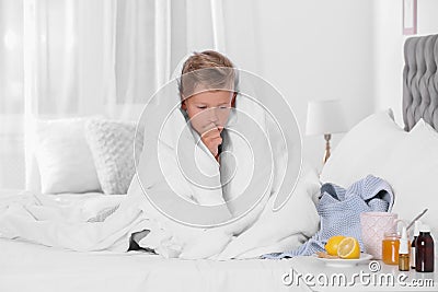 Ill boy suffering from cough Stock Photo