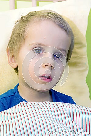 Ill child in bed Stock Photo