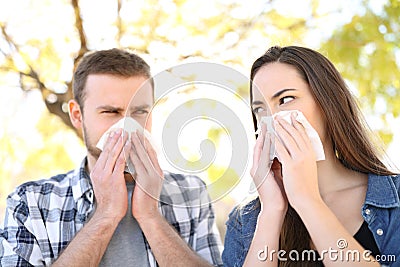 Ill couple suffering contagious flu outdoors Stock Photo