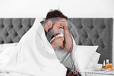 Ill man suffering from cough Stock Photo