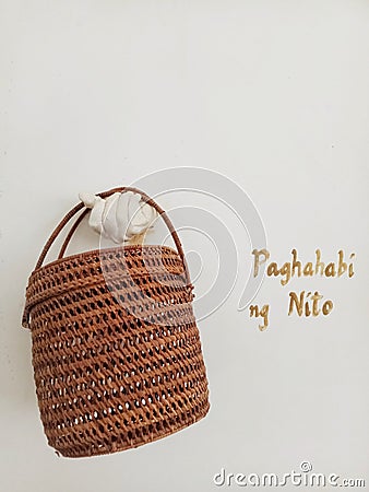 Ille cave Museum in El Nido, Palawan - July 11, 2020: A woven Nito basket in museum display Editorial Stock Photo