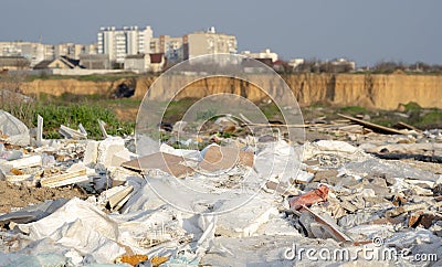 Illegal dumping of garbage in the city's quarry, plastic and other waste. Dangerous pollution in nature Stock Photo