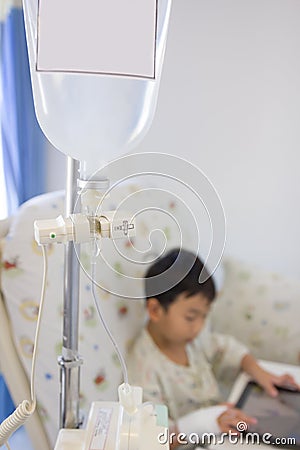 Illness asian boy lying on sickbed in hospital. Vintage style. Stock Photo