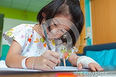 Illness girl admitted in hospital while saline intravenous IV on hand. Stock Photo