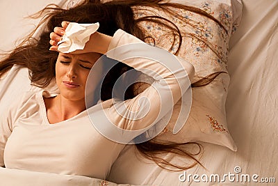 Illness woman having headache and feeling unweal Stock Photo