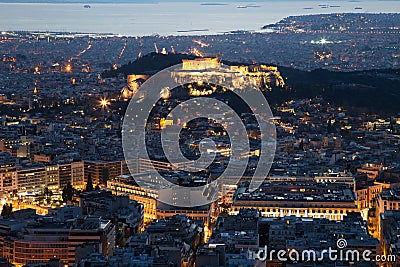 Illuminated Acropolis in Athens, Greece at dusk Stock Photo