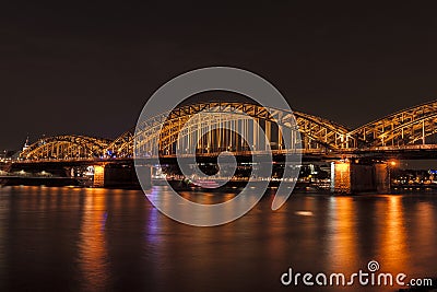 Illuminated bridge in Cologne at night Stock Photo