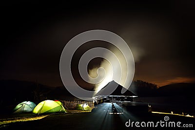 Illuminated camping tents at night in alpin zone Editorial Stock Photo