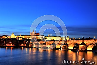 Illuminated Charles Bridge with Prague Castle at Dusk, Prague Stock Photo