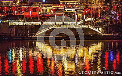 Illuminated Chinese Gate Grand Canal NIght Reflection Hangzhou Zhejiang China Stock Photo