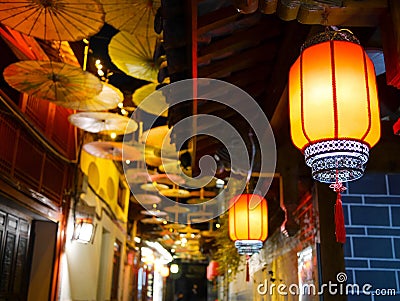 Illuminated Chinese lanterns and decorative chinese oil-paper umbrellas Stock Photo
