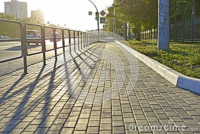 Illuminated cobbled street of the city in summer Stock Photo