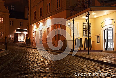 Illuminated cobbled street by late evening , Vienna. Stock Photo