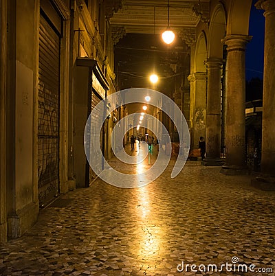 Illuminated cobbled street in Rome, Italy Stock Photo