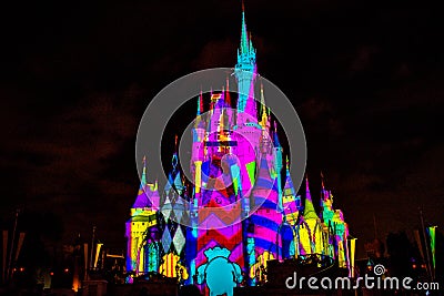 Illuminated and colorful Cinderella Castle in One Upon a Time Show at Magic Kingdom 3. Editorial Stock Photo