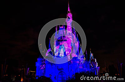Illuminated and colorful Cinderella Castle in One Upon a Time Show at Magic Kingdom 8. Editorial Stock Photo