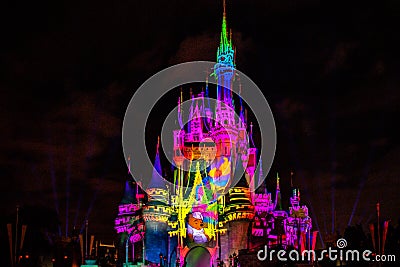 Illuminated and colorful Cinderella Castle in One Upon a Time Show at Magic Kingdom 82. Editorial Stock Photo