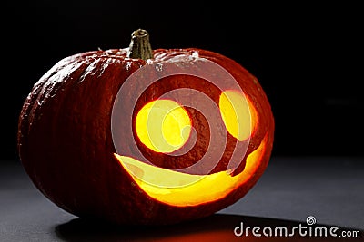 Illuminated cute halloween pumpkin Stock Photo