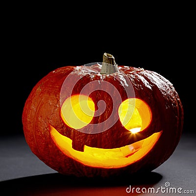 Illuminated cute halloween pumpkin Stock Photo