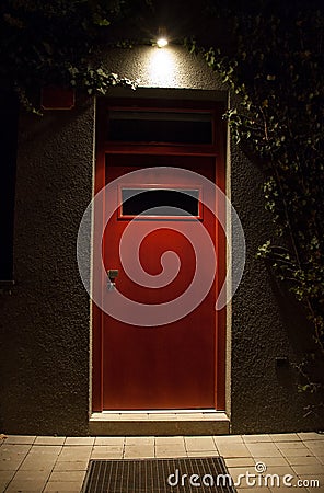 Illuminated door at night Stock Photo