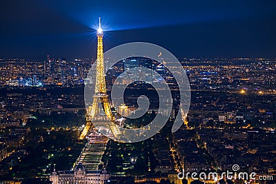 Illuminated Eiffel Tower and panoramic aerial view of Paris Editorial Stock Photo