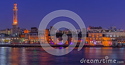 Illuminated embankment in Abu Dhabi city at night, Sheikh Zayed Grand Mosque Stock Photo