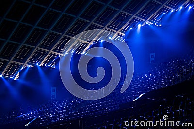 Illuminated empty blue stadium with a large stage Stock Photo