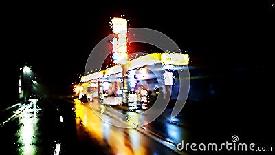 Illuminated gas station in rainy night ver.1 Stock Photo