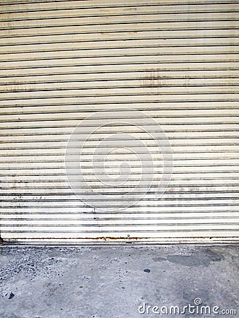 Illuminated grunge metallic roller shutter door Stock Photo