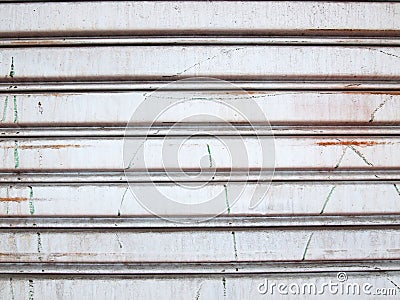 Illuminated grunge metallic roller shutter door Stock Photo