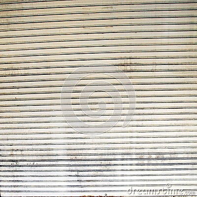 Illuminated grunge metallic roller shutter door Stock Photo