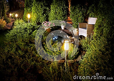 Illuminated home garden fountain patio Stock Photo