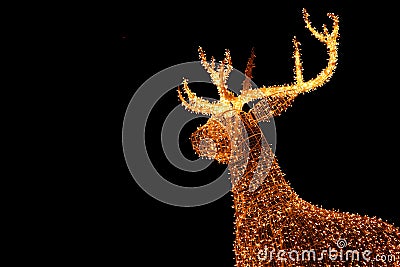 Illuminated LED String Gold Giant Reindeer of Outdoor Christmas Decoration Against Night Sky Stock Photo