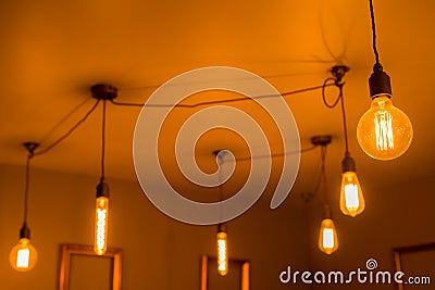 Illuminated Light Bulbs of Various Shapes Stock Photo