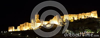 Illuminated Medieval castle of Narikala in Tbilisi Stock Photo