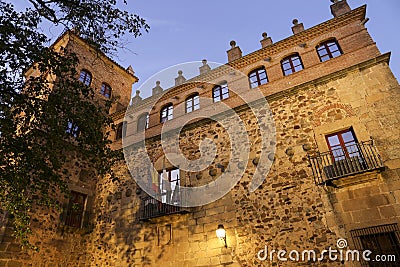 Illuminated narrow streets and Facades of historic houses in Caceres city Editorial Stock Photo