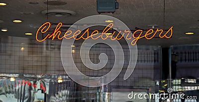 An illuminated neon Cheeseburger sign Stock Photo