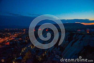 Illuminated at night streets of Goreme, Turkey, Cappadocia. The famous center of flight balloons. Amazing night Stock Photo