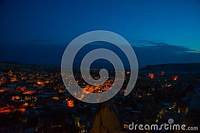 Illuminated at night streets of Goreme, Turkey, Cappadocia. The famous center of flight balloons. Amazing night Stock Photo