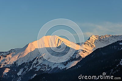 Illuminated peaks of austrian mountain Stock Photo