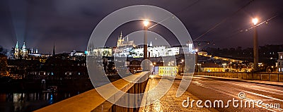 Illuminated Prague Castle by night Stock Photo