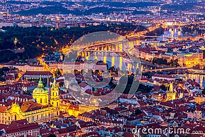 Illuminated Prague at twilight blue hour. VIew from Petrin hill Stock Photo
